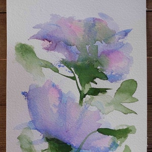 May include: Watercolor painting of two purple flowers with green leaves and stems on a white background. The artist's signature "ALEY" is in the bottom right corner.
