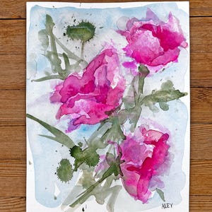 May include: Watercolor painting of pink flowers with green stems and leaves on a light blue background. The artist's signature "ALEY" is in the bottom right corner.