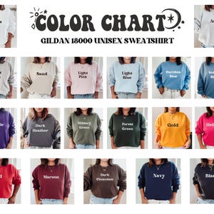May include: Color chart for Gildan 18000 unisex sweatshirts, showing 20 different color options. The colors include white, ash, sport grey, sand, light pink, light blue, Carolina blue, indigo blue, purple, dark heather, military green, forest green, gold, heliconia, red, maroon, dark chocolate, navy, and black.
