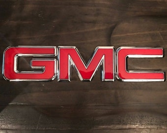 GMC front grille emblem red & black chrome sierra yukon savanna 22881265