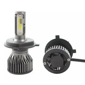 May include: Two car headlights with a cooling fan. The headlights are white and have a black plastic housing. The fan is black and has a silver metal grill.