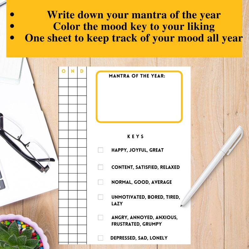 May include: A printable mood tracker with a yellow box for writing a mantra of the year. The tracker has a grid for each day of the year and a list of mood keys to colour in, including happy, joyful, great, content, satisfied, relaxed, normal, good, average, unmotivated, bored, tired, lazy, angry, annoyed, anxious, frustrated, grumpy, depressed, sad, and lonely.