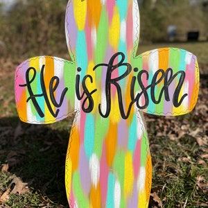 He is Risen Multi colored crackled cross door hanger