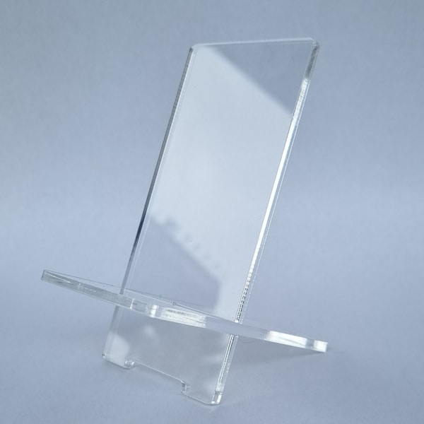 Stand made of acrylic glass, DVD stand, mobile phone stand or smartphone holder for desk.