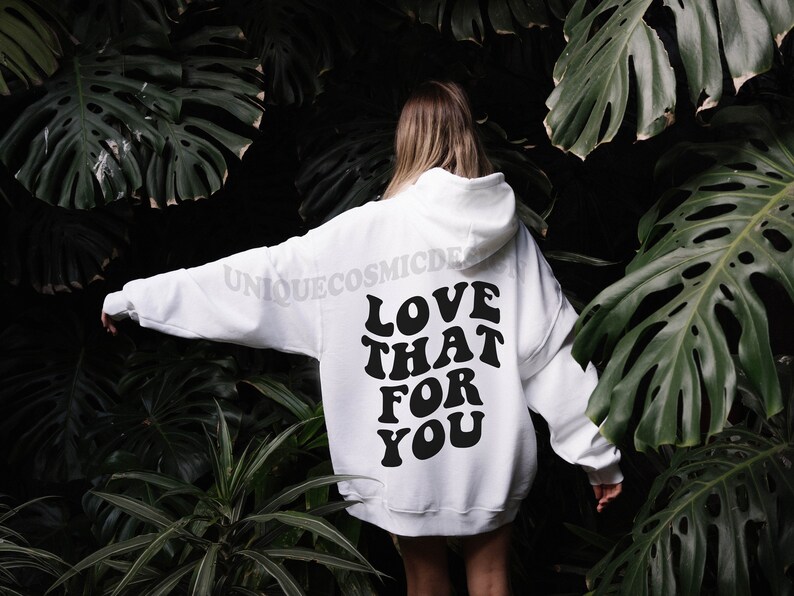 May include: White hooded sweatshirt with the text "LOVE THAT FOR YOU" printed in black on the back.