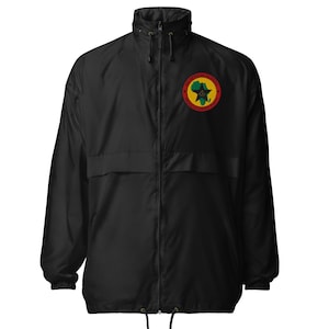 May include: Black windbreaker jacket with a high collar and a full-length zipper. A circular patch on the chest features a green silhouette of Africa, a red star, and text in a yellow ring. The jacket has a drawstring at the hem.