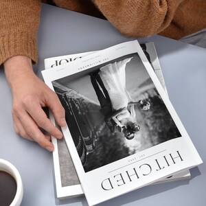 May include: A black and white photo of a couple on their wedding day, featured on the cover of a magazine titled "Hitched" with the date "1st 2023".