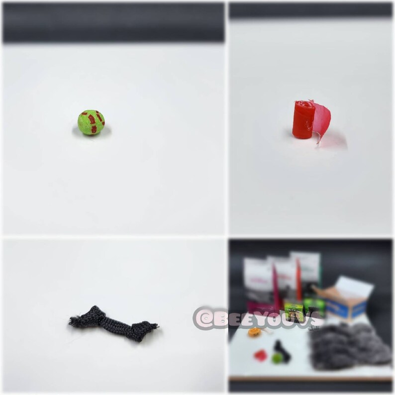 Puede incluir: Primer plano de una pelota verde y roja, un trozo de tela roja enrollado, una cuerda negra y un objeto peludo gris. Tambi&eacute;n hay otros objetos en el fondo, incluyendo una caja con el texto "BEEYOUS" en ella.