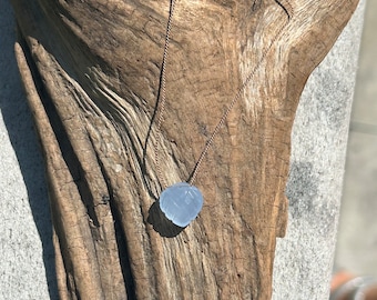 Carved Periwinkle Chalcedony necklace, Silk cord, Sterling clasp