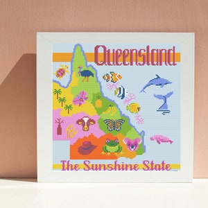 May include: A colourful cross-stitch design of the state of Queensland, Australia. The design includes a map of the state with various animals, plants, and symbols. The text "Queensland" and "The Sunshine State" are included in the design.
