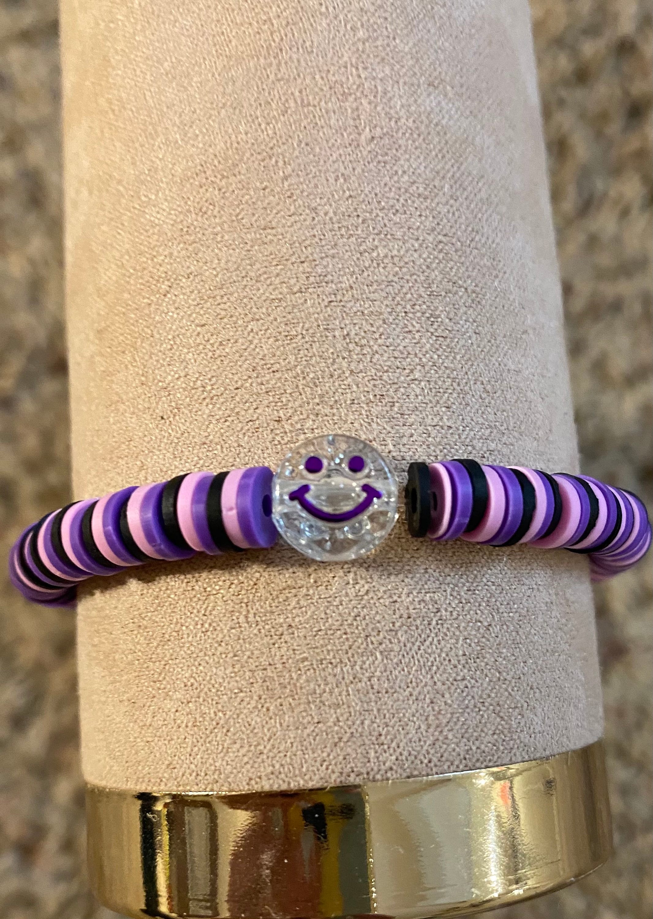 clay beads bracelets. one is purple with a flower - Depop