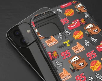 May include: A clear phone case with a black background and a repeating pattern of red and orange cartoon cars, checkered flags, and the text "Rusteze" and "Cozy Cone Motel".