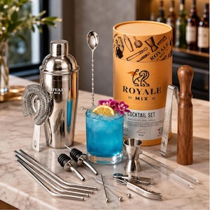 May include: A stainless steel cocktail set including a shaker, strainer, long mixing spoon, two pourers, four bent straws, a jigger, tongs, a wooden muddler, and a corkscrew, presented with a cylindrical box labeled Royale 20 Mix 19.