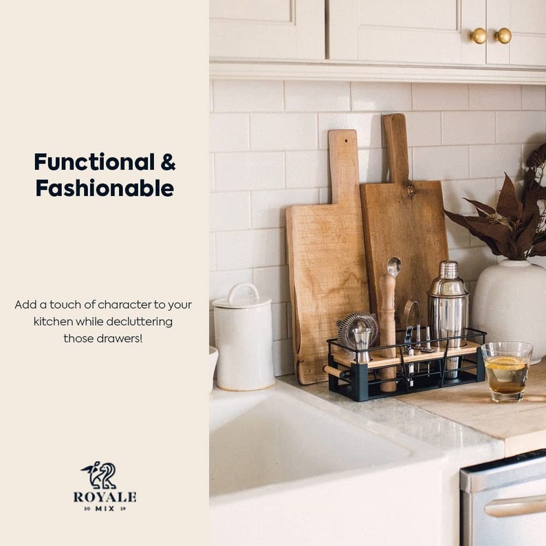 May include: A black metal kitchen countertop organizer with wooden cutting boards, a cocktail shaker, and bar tools. The organizer is on a white countertop with white subway tile backsplash.