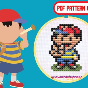 May include: A cross-stitch pattern of a pixelated character in a yellow hoop. The character wears a red cap, blue shorts, and a striped shirt. The image also features a cartoon character with a red cap and a blue and yellow striped shirt. Text reads "PDF PATTERN ONLY" and "@sewnerdybybreigh".