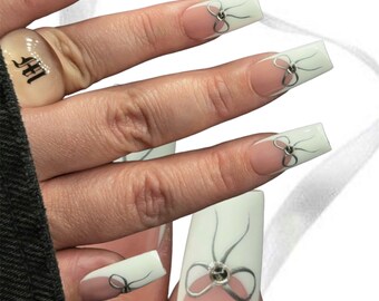 Silver bow nails | French nails | press ons | press on nails | bow nails | nails | trendy nails | white French nails