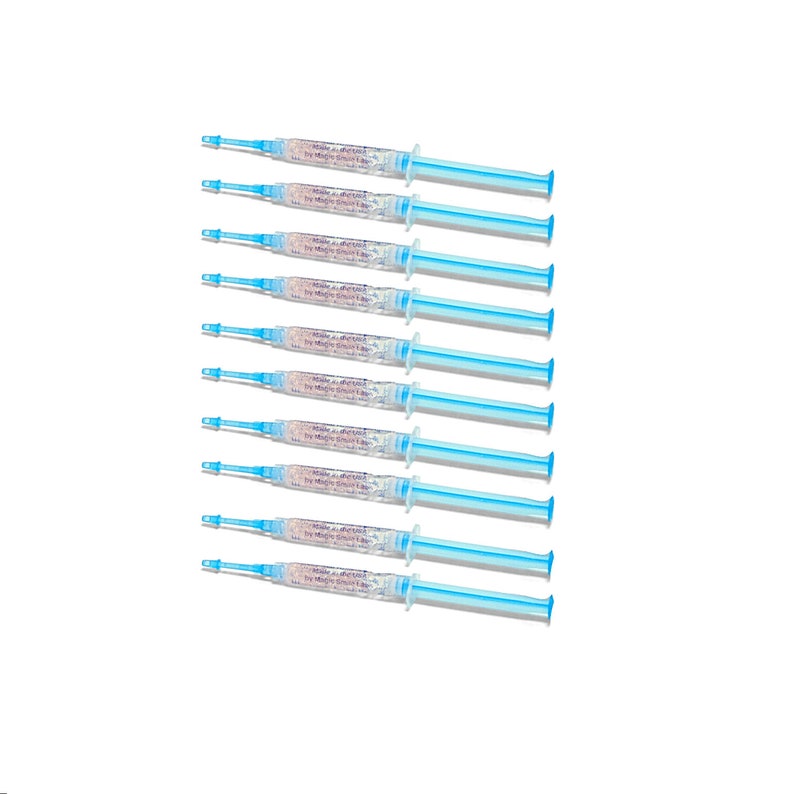 May include: Eight blue and white syringes filled with a clear gel containing small white particles. The syringes are labeled "Magic Smile Labs".