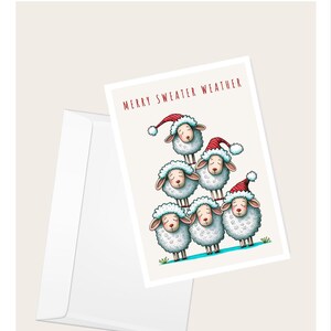 Cartão de saudação "Merry Sweater Weather" de ovelhas com chapéus de Papai Noel | Cartão de Natal bem-humorado | Cartão de nota em branco elegante
