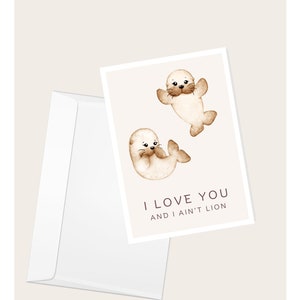 Carte de voeux « Je t'aime et je ne suis pas un lion » pour bébé otarie | Saint-Valentin | Anniversaire | Amour et romance | Carte de correspondance vierge élégante