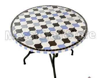 Black, blue and beige cocktail table handmade with real mosaic tiles on top and edges of table with metal legs