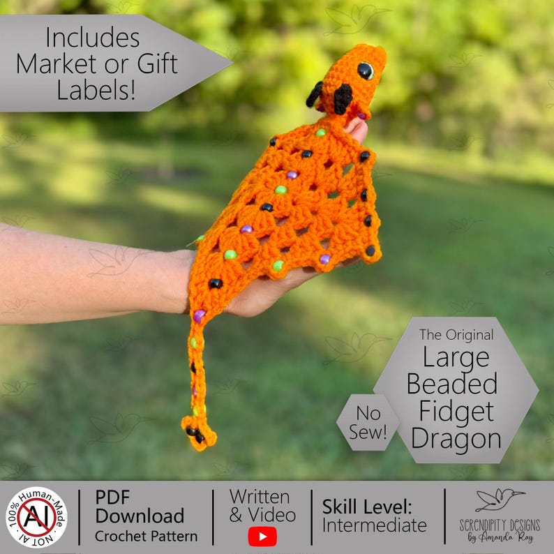 May include: An orange crochet dragon with black and colorful beads. The dragon has a long tail and is labeled "The Original Large Beaded Fidget Dragon". The image also includes text that says "No Sew!" and "Skill Level: Intermediate".