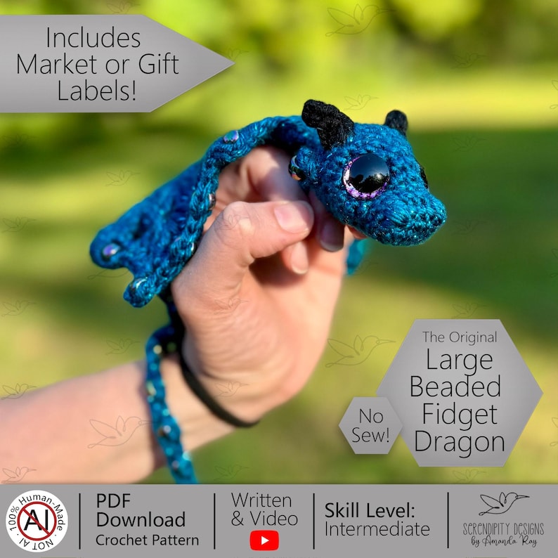May include: A handmade blue crochet dragon with black accents and large, purple-rimmed eyes. The dragon is labeled "The Original Large Beaded Fidget Dragon" and is designed with an intermediate skill level. The image also includes text that says "No Sew!"