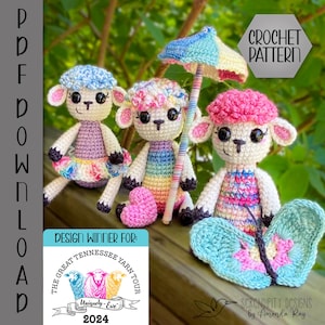 May include: Three crocheted amigurumi lambs with colorful clothing and accessories. The lamb on the left is wearing a purple dress with a rainbow skirt. The middle lamb is wearing a rainbow striped dress and holding a pink heart. The lamb on the right is wearing a pink and white striped dress and holding a blue butterfly. The text "Design Winner For: The Great Tennessee Yarn Tour 2024" is visible in the lower left corner.