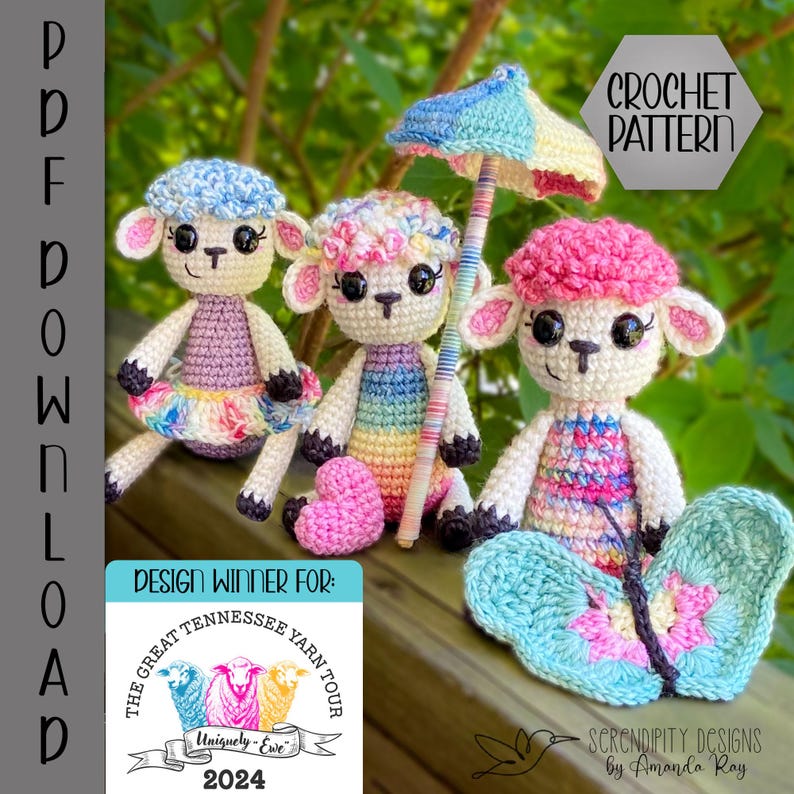 May include: Three crocheted amigurumi lambs with colorful clothing and accessories. The lamb on the left is wearing a purple dress with a rainbow skirt. The middle lamb is wearing a rainbow striped dress and holding a pink heart. The lamb on the right is wearing a pink and white striped dress and holding a blue butterfly. The text "Design Winner For: The Great Tennessee Yarn Tour 2024" is visible in the lower left corner.