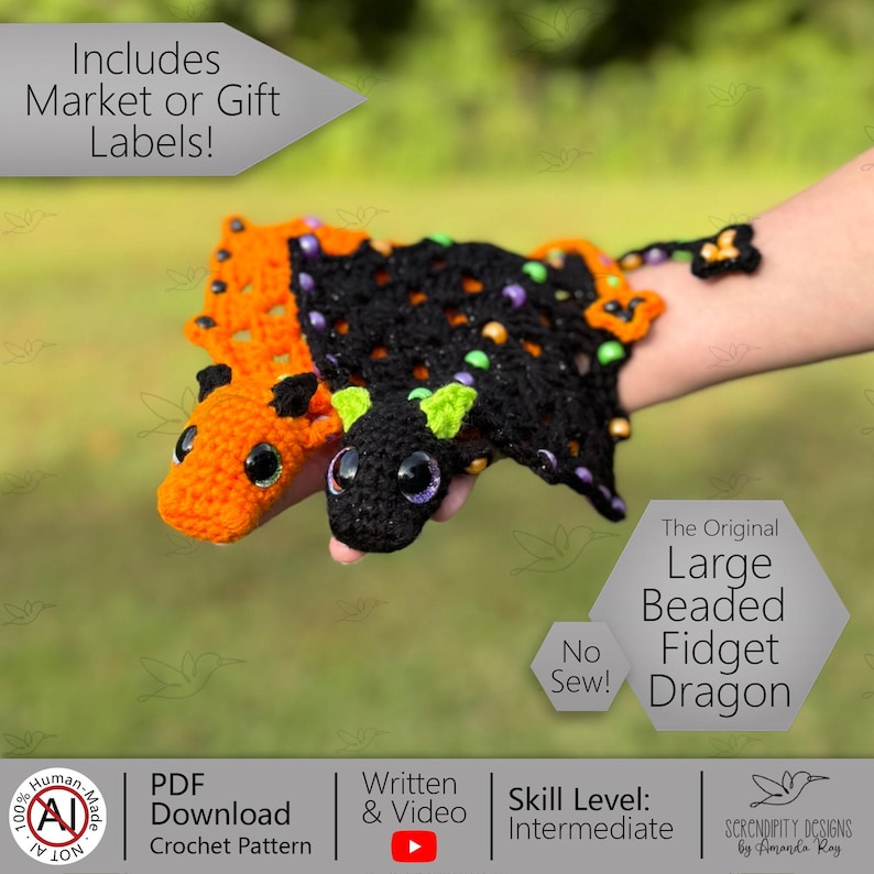 May include: Two crocheted dragon fidget toys, one orange and one black, are displayed. The black dragon has green accents and purple eyes. The orange dragon has black accents and black eyes. The text on the image says "The Original Large Beaded Fidget Dragon".