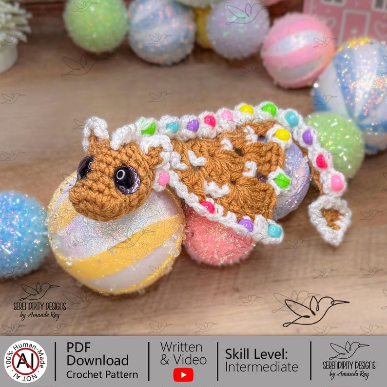 May include: A crocheted creature in brown with a white mane and colourful details, resting on a decorative ball. The image features text stating "PDF Download Crochet Pattern". The skill level is intermediate.