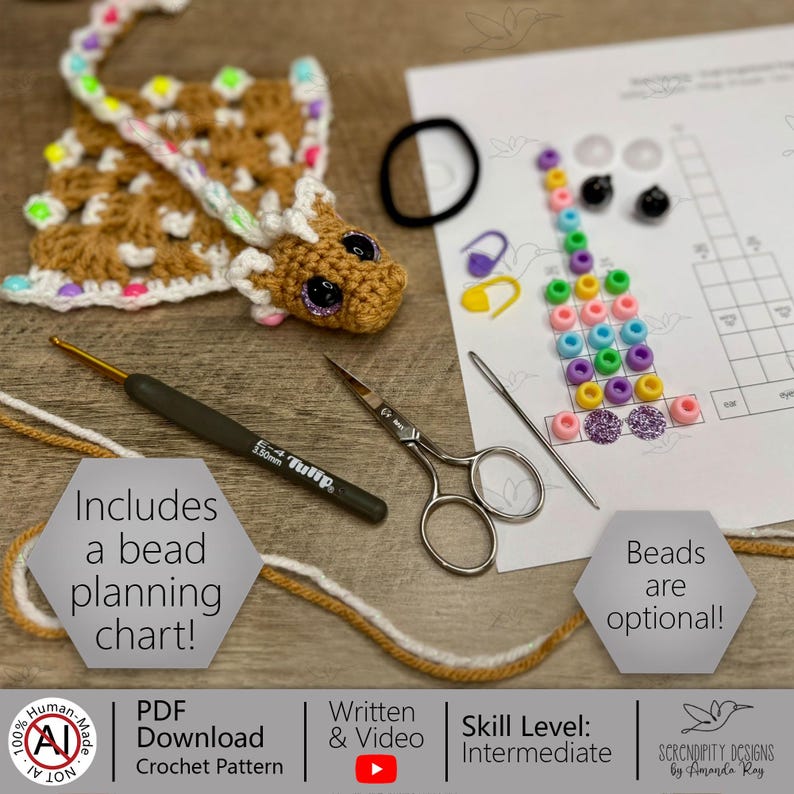 May include: A crochet pattern featuring a brown giraffe, crochet hook, scissors, and beads. The image includes a bead planning chart and the text "Beads are optional!" and "Includes a bead planning chart!"