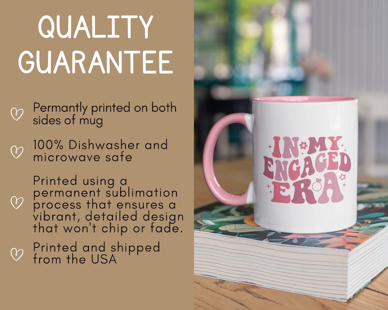May include: White ceramic mug with a pink rim and handle. The mug has a pink and white graphic that says "In My Engaged Era" with a small ring and star design.