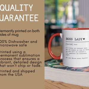 May include: White ceramic mug with a red handle and red rim. The mug has the text "BOSS LADY [bos-lade] noun 1) A strong and intelligent woman who can complete all tasks set before her with grace and confidence a true superhuman and multitasking expert. See also Miracle worker, Superhero" printed on it.