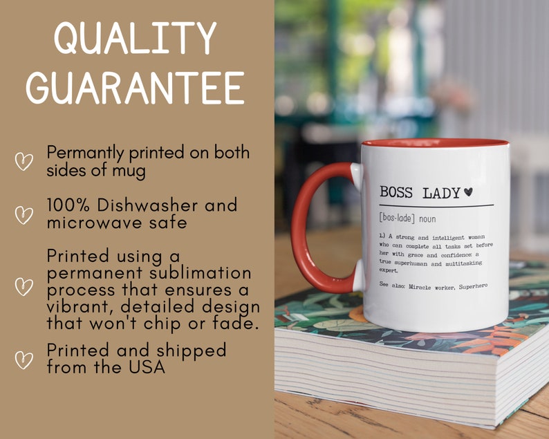 May include: White ceramic mug with a red handle and red rim. The mug has the text "BOSS LADY [bos-lade] noun 1) A strong and intelligent woman who can complete all tasks set before her with grace and confidence a true superhuman and multitasking expert. See also Miracle worker, Superhero" printed on it.