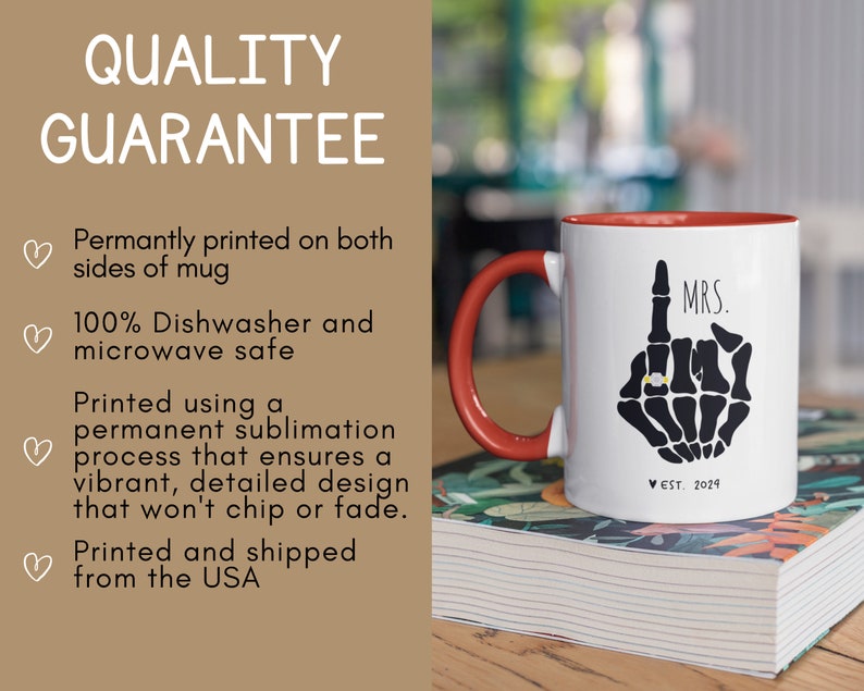 May include: White ceramic coffee mug with a red rim and handle. The mug features a black skeleton hand with a ring on the index finger and the text "MRS. EST. 2024".