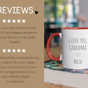 May include: White ceramic mug with a red handle and interior. The mug has the text "I LOVE YOU, GRANDMA" and "MATH" in black. The mug is sitting on a book with a floral design.