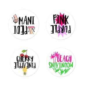 May include: Four white circular stickers with black text and colourful graphics. One says "Mani Pedi" with nail art illustrations. Another says "Pink Purple" with a pink burst. The third says "Cherry Pineapple". The last says "Beach Mountains".