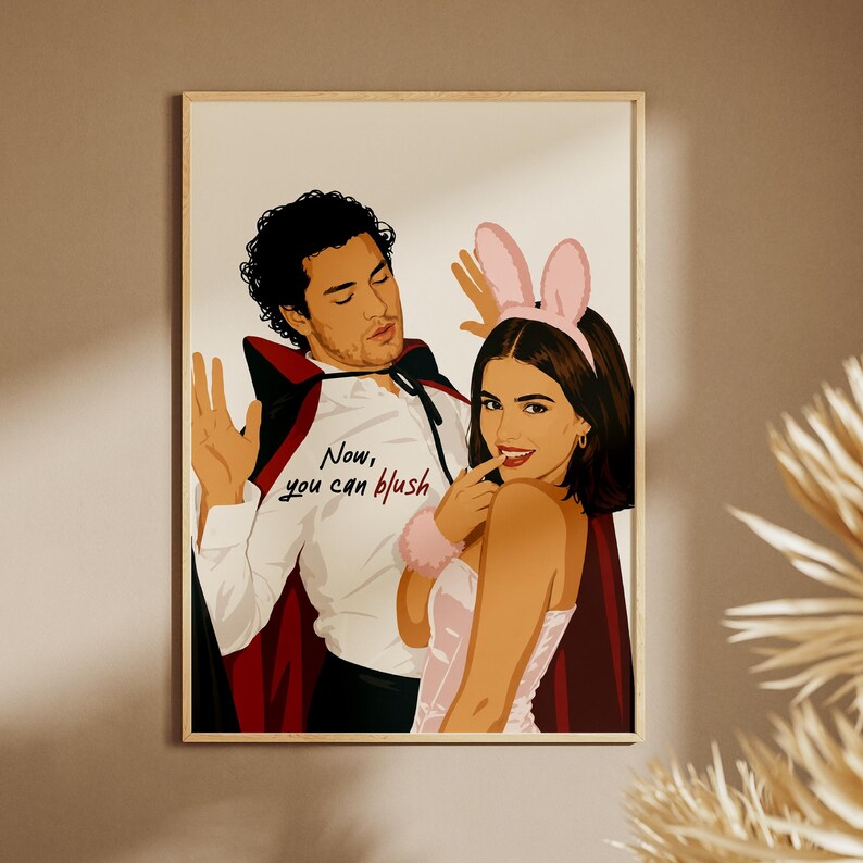 Stylized digital wall art featuring a romantic college couple inspired by a popular sports romance book series. The artwork shows a dark-haired male character dressed in a playful vampire costume beside a smiling female character wearing pink bunny ears. The illustration includes the quote "Now, you can blush" and is rendered in a modern minimalist portrait style with clean lines and soft colors. Perfect for romance readers, book lovers, and contemporary literary-inspired home decor.