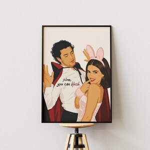 Stylized digital wall art featuring a romantic college couple inspired by a popular sports romance book series. The artwork shows a dark-haired male character dressed in a playful vampire costume beside a smiling female character wearing pink bunny ears. The illustration includes the quote "Now, you can blush" and is rendered in a modern minimalist portrait style with clean lines and soft colors. Perfect for romance readers, book lovers, and contemporary literary-inspired home decor.
