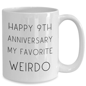 May include: White ceramic coffee mug with black text that reads "Happy 9th Anniversary My Favourite Weirdo".