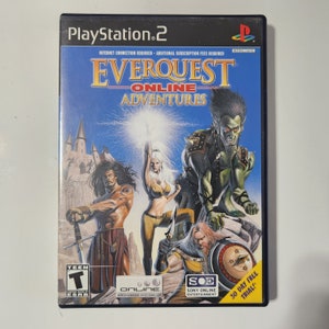 May include: PlayStation 2 game case for EverQuest Online Adventures. The cover art features a fantasy scene with three characters, a green-skinned humanoid, a woman with blonde hair, and a man with dark hair. The game case is blue and black with the game title in white.