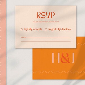 A wedding RSVP card and a monogram card with a bold, modern design. The RSVP card is beige with red-orange text, featuring options to 'Joyfully accept' or 'Regretfully decline,' along with a space for guest names. The monogram card is deep orange with the initials 'H & J' in a mix of soft pink and red-orange, accented with wavy line details. The design uses warm, earthy tones and stylish typography.
