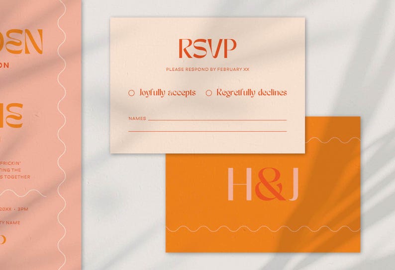 A wedding RSVP card and a monogram card with a bold, modern design. The RSVP card is beige with red-orange text, featuring options to 'Joyfully accept' or 'Regretfully decline,' along with a space for guest names. The monogram card is deep orange with the initials 'H & J' in a mix of soft pink and red-orange, accented with wavy line details. The design uses warm, earthy tones and stylish typography.