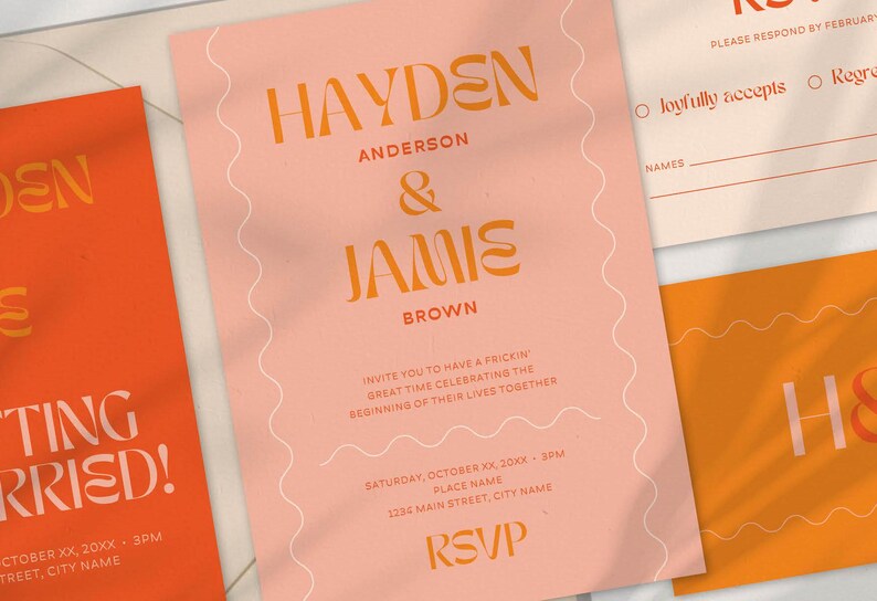 A set of wedding invitation stationery featuring a bold and modern design. The main invitation card is blush pink with warm orange text displaying names in a stylish font. It has wavy line accents on the sides. Other elements include a bright orange 'Save the Date' card with large, bold typography, an RSVP card, and a monogram card with 'H & J' in contrasting pink and orange. The color palette consists of warm tones, creating a contemporary and playful wedding aesthetic.