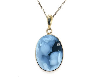 May include: A gold chain necklace with a blue cameo pendant depicting a mother and child. The cameo has a small diamond accent.