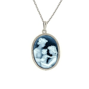 May include: A silver chain necklace with a blue cameo pendant featuring a white silhouette of a mother and two children.