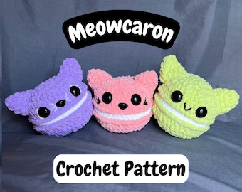 May include: Three crocheted cat-shaped macarons in purple, pink, and green. The macarons have white frosting and black eyes. The text "Meowcaron Crochet Pattern" is below the macarons.