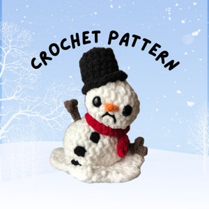 May include: A crochet pattern for a melting snowman with a black top hat and a red scarf. The snowman has a sad expression and is melting into a puddle of snow.