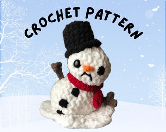 May include: A crochet pattern for a melting snowman with a black top hat and a red scarf. The snowman has a sad expression and is melting into a puddle of snow.