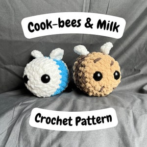 May include: Crochet pattern for two bee plushies, one white and blue, the other brown and tan. The pattern is titled "Cook-bees & Milk".